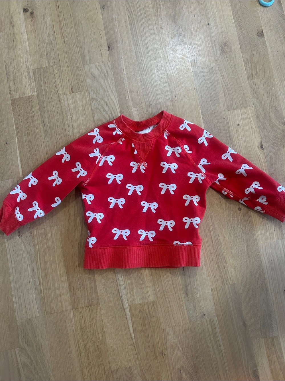 Hanna Andersson Red Sweatshirt with White Bow Pattern